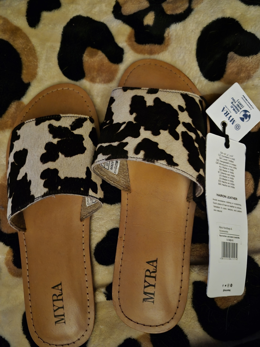 Myra Cow-Print Hairon Leather Slide Sandals in Black and White